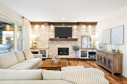 163 Cranarch Landing Se, Calgary, AB - Indoor Photo Showing Living Room With Fireplace