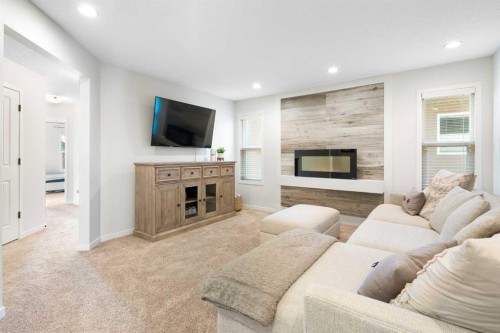 163 Cranarch Landing Se, Calgary, AB - Indoor Photo Showing Living Room With Fireplace