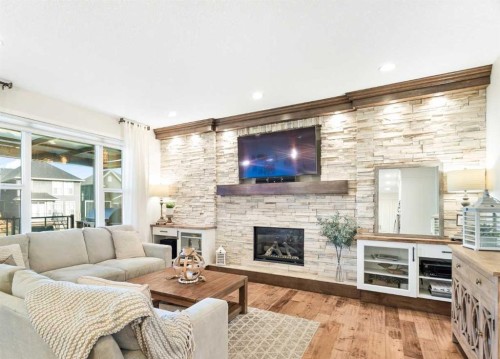 163 Cranarch Landing Se, Calgary, AB - Indoor Photo Showing Living Room With Fireplace