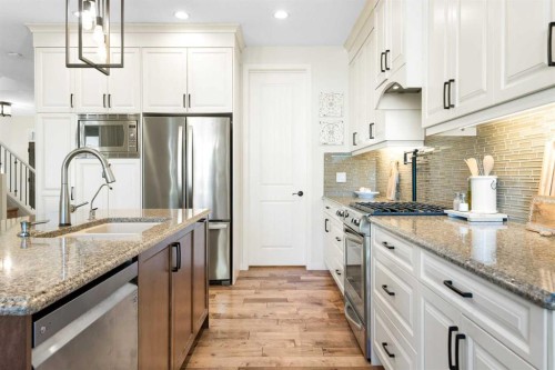 163 Cranarch Landing Se, Calgary, AB - Indoor Photo Showing Kitchen With Double Sink With Upgraded Kitchen