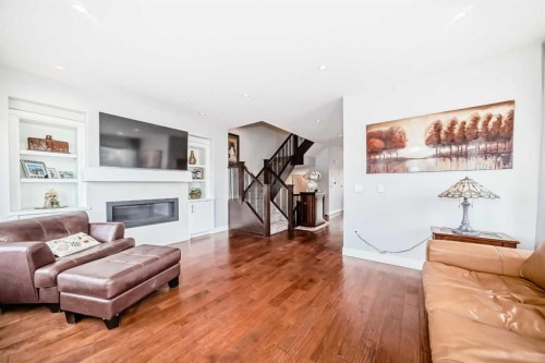 4640 15 Avenue Nw, Calgary, AB - Indoor Photo Showing Living Room With Fireplace