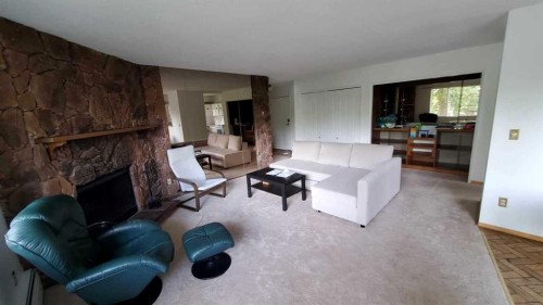 15-821 3 Avenue Sw, Calgary, AB - Indoor Photo Showing Living Room With Fireplace