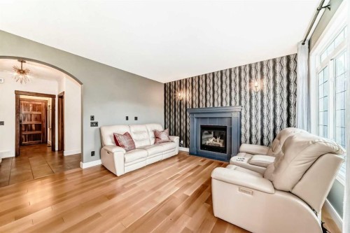 2 Tuscany Estates Crescent Nw, Calgary, AB - Indoor Photo Showing Living Room With Fireplace