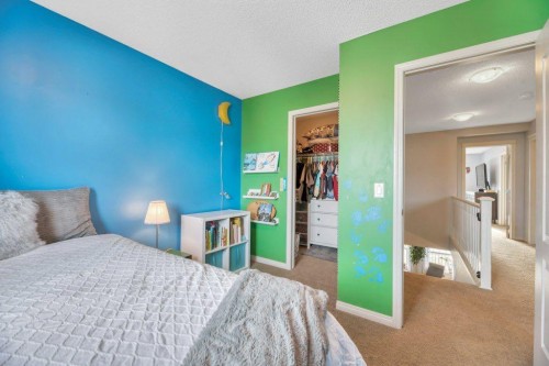 32 Copperpond Heights Se, Calgary, AB - Indoor Photo Showing Bedroom