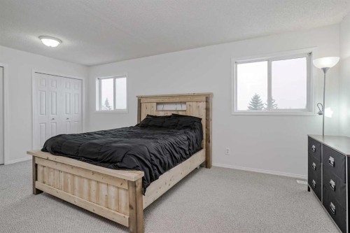 4 Bridleridge Circle Sw, Calgary, AB - Indoor Photo Showing Bedroom