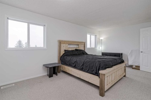 4 Bridleridge Circle Sw, Calgary, AB - Indoor Photo Showing Bedroom