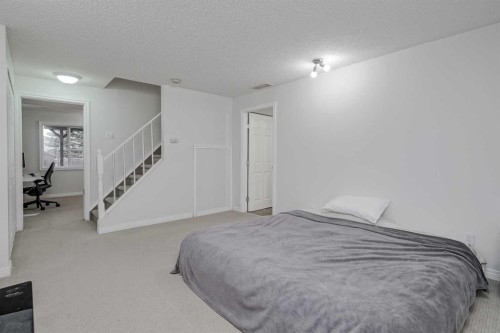 4 Bridleridge Circle Sw, Calgary, AB - Indoor Photo Showing Bedroom