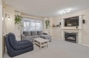 4 Bridleridge Circle Sw, Calgary, AB  - Indoor Photo Showing Living Room With Fireplace 