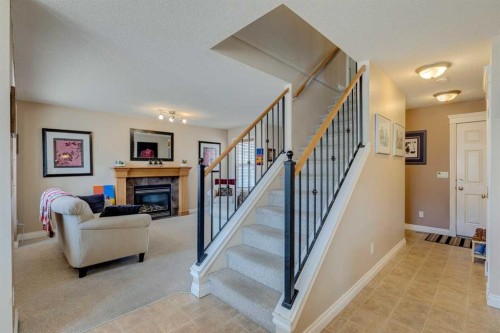 184 Cimarron Park Circle, Okotoks, AB - Indoor With Fireplace