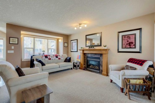 184 Cimarron Park Circle, Okotoks, AB - Indoor Photo Showing Living Room With Fireplace