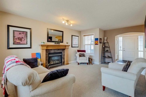 184 Cimarron Park Circle, Okotoks, AB - Indoor Photo Showing Living Room With Fireplace