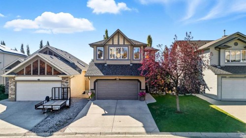 155 Sunset Close, Cochrane, AB - Outdoor With Facade