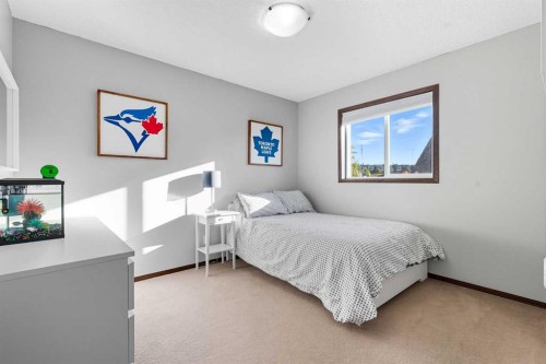 155 Sunset Close, Cochrane, AB - Indoor Photo Showing Bedroom