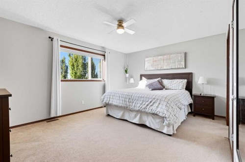 155 Sunset Close, Cochrane, AB - Indoor Photo Showing Bedroom