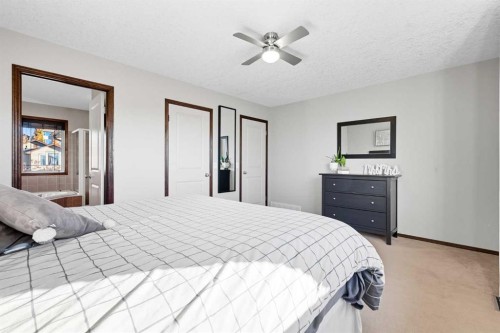 155 Sunset Close, Cochrane, AB - Indoor Photo Showing Bedroom