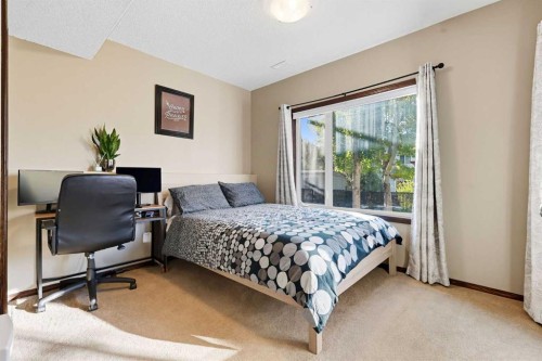 155 Sunset Close, Cochrane, AB - Indoor Photo Showing Bedroom