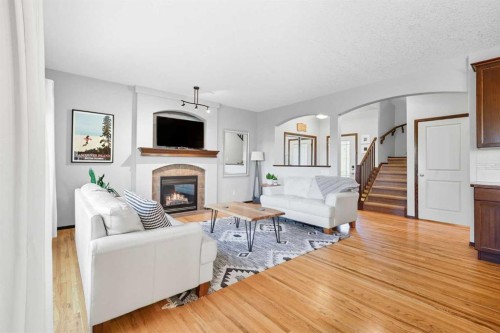 155 Sunset Close, Cochrane, AB - Indoor Photo Showing Living Room With Fireplace