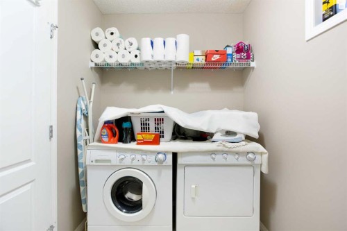28 Kinlea Link Nw, Calgary, AB - Indoor Photo Showing Laundry Room