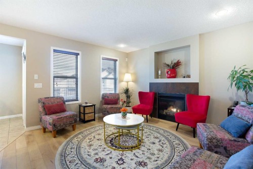 28 Kinlea Link Nw, Calgary, AB - Indoor Photo Showing Living Room With Fireplace