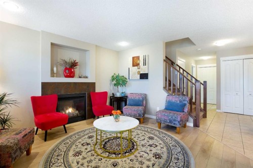 28 Kinlea Link Nw, Calgary, AB - Indoor Photo Showing Living Room With Fireplace