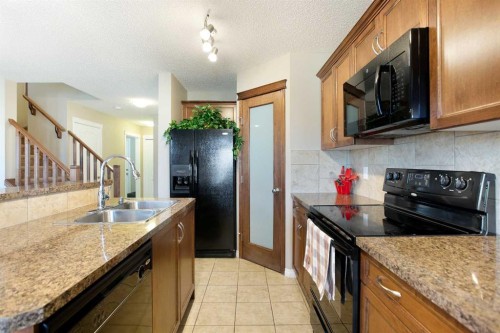 28 Kinlea Link Nw, Calgary, AB - Indoor Photo Showing Kitchen With Double Sink