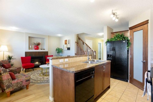 28 Kinlea Link Nw, Calgary, AB - Indoor Photo Showing Other Room With Fireplace