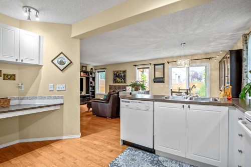 85 Bridleridge Road Sw, Calgary, AB - Indoor Photo Showing Kitchen With Double Sink