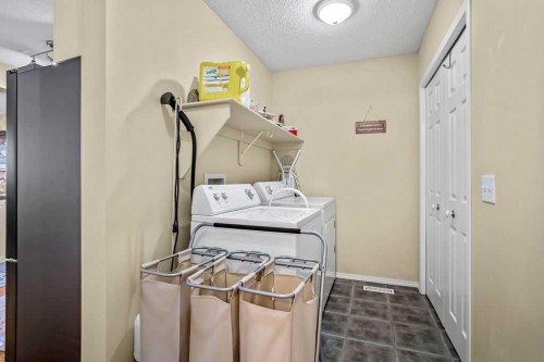 85 Bridleridge Road Sw, Calgary, AB - Indoor Photo Showing Laundry Room