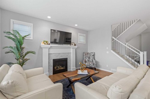 240 Cranbrook Circle Se, Calgary, AB - Indoor Photo Showing Living Room With Fireplace