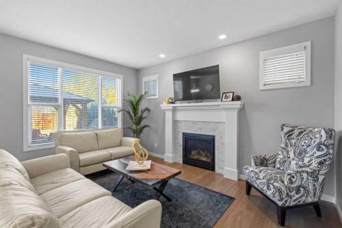 240 Cranbrook Circle Se, Calgary, AB - Indoor Photo Showing Living Room With Fireplace