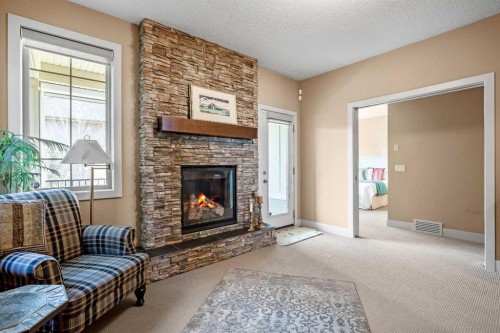 116 Wentworth Square Sw, Calgary, AB - Indoor Photo Showing Living Room With Fireplace