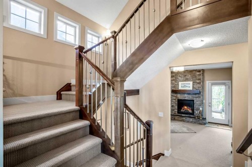 116 Wentworth Square Sw, Calgary, AB - Indoor Photo Showing Other Room With Fireplace