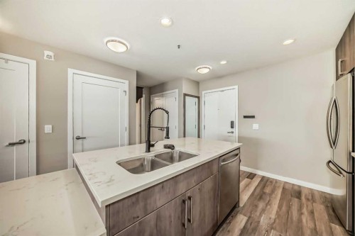 312-8530 8A Avenue Sw, Calgary, AB - Indoor Photo Showing Kitchen With Double Sink