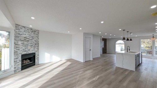 4 Harvey Place Sw, Calgary, AB - Indoor Photo Showing Living Room With Fireplace