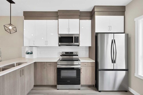 612 Red Sky Villas Ne, Calgary, AB - Indoor Photo Showing Kitchen With Stainless Steel Kitchen With Double Sink With Upgraded Kitchen