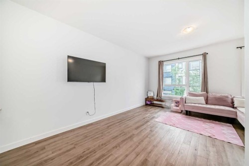 208-15 Evanscrest Park Nw, Calgary, AB - Indoor Photo Showing Living Room