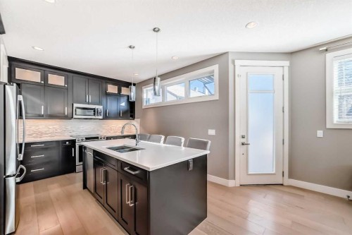2-413 25 Avenue Ne, Calgary, AB - Indoor Photo Showing Kitchen With Double Sink With Upgraded Kitchen