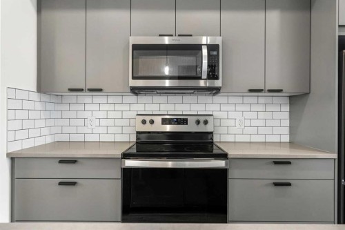 1206-525 River Heights Drive, Cochrane, AB - Indoor Photo Showing Kitchen With Upgraded Kitchen
