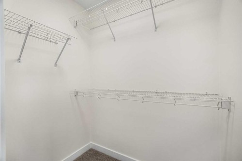 1206-525 River Heights Drive, Cochrane, AB - Indoor With Storage