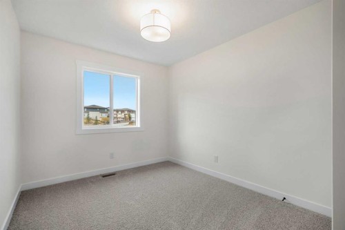 1206-525 River Heights Drive, Cochrane, AB - Indoor Photo Showing Other Room