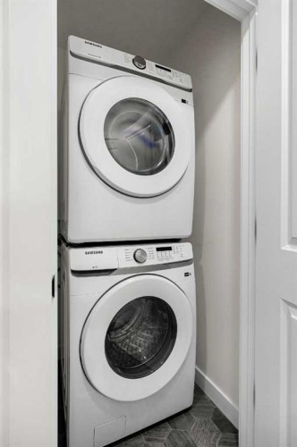 1206-525 River Heights Drive, Cochrane, AB - Indoor Photo Showing Laundry Room