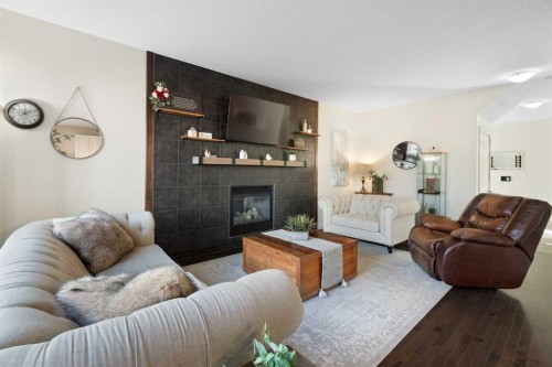 47 Copperstone Mews Se, Calgary, AB - Indoor Photo Showing Living Room With Fireplace