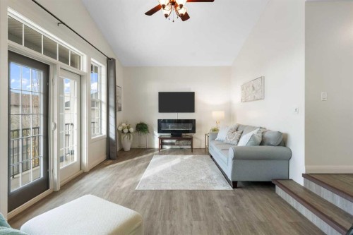 47 Copperstone Mews Se, Calgary, AB - Indoor Photo Showing Living Room With Fireplace