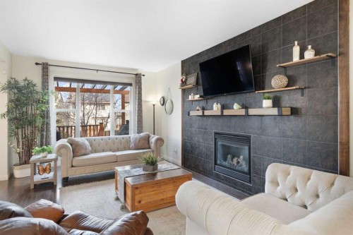 47 Copperstone Mews Se, Calgary, AB - Indoor Photo Showing Living Room With Fireplace