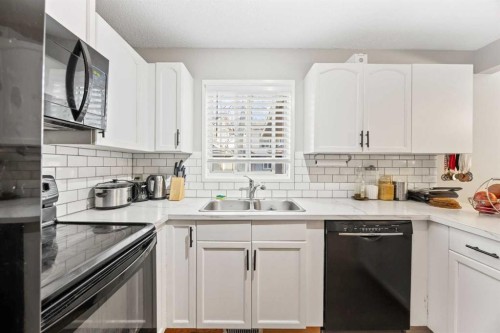502 Signal Hill Green Sw, Calgary, AB - Indoor Photo Showing Kitchen With Double Sink