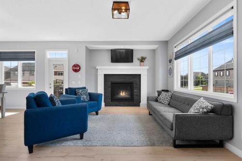 103 Masters Rise Se, Calgary, AB - Indoor Photo Showing Living Room With Fireplace
