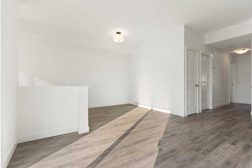 605-24 Rivercrest Drive, Cochrane, AB - Indoor Photo Showing Other Room