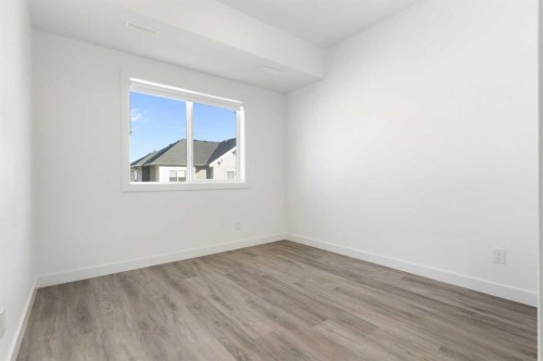 605-24 Rivercrest Drive, Cochrane, AB - Indoor Photo Showing Other Room