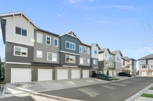 605-24 Rivercrest Drive, Cochrane, AB - Outdoor With Facade