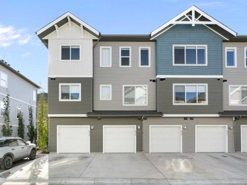 605-24 Rivercrest Drive, Cochrane, AB - Outdoor With Facade